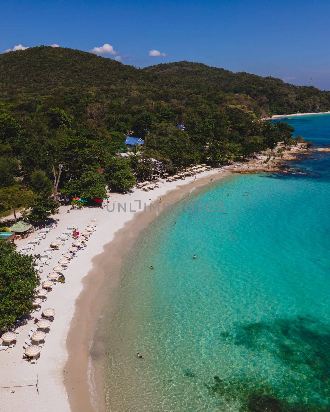 Koh Samet Island Thailand, aerial drone view from above at the Samed Island in Thailand with a turqouse colored ocean and a white tropical beach from above drone view