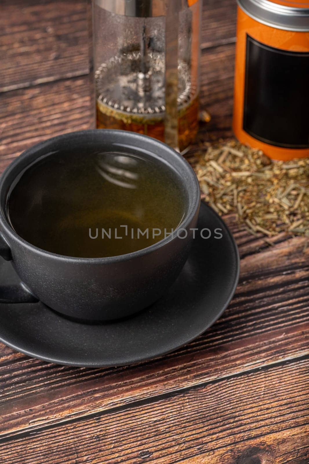 Freshly brewed hot winter tea on a wooden table