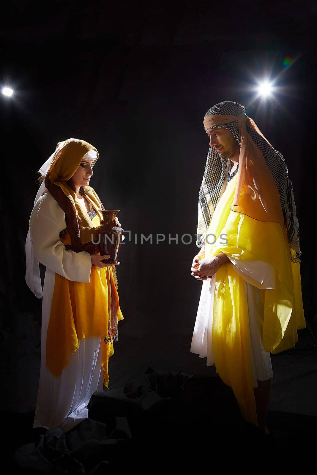 A couple in love or a married couple in stylized Eastern clothing from Israel, Palestine, Iran, Pakistan together. A tender photo session in the style of the Middle East and the Bible by keleny