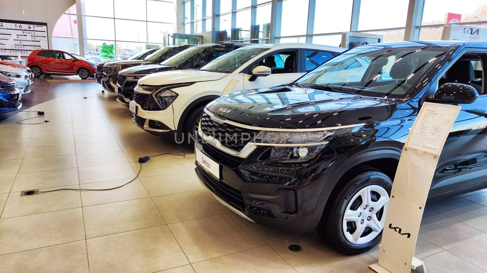 Kazan, Russia - April 04, 2023: Car in showroom of dealership KIA. Re-export to Russia by keleny