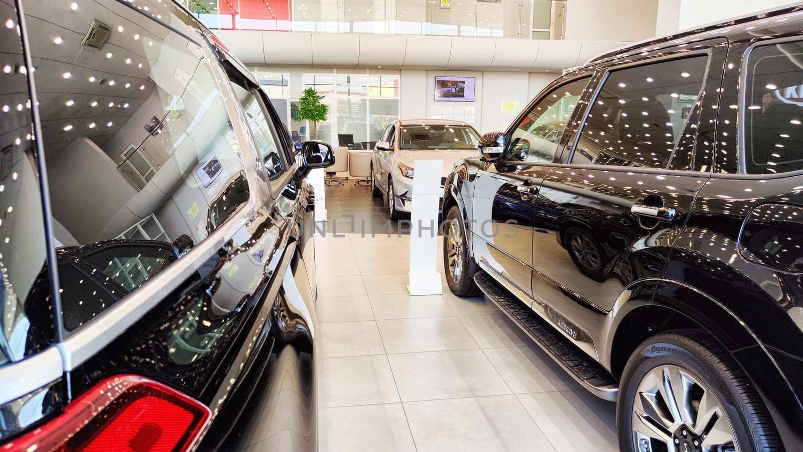 Kazan, Russia - April 04, 2023: Car in showroom of dealership KIA. Re-export to Russia by keleny