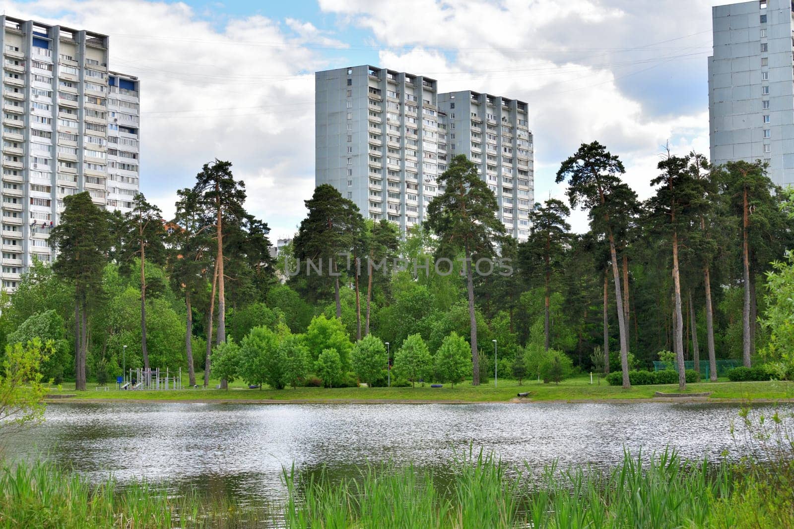 Multi-storey residential buildings on shore of Shkolnoye Lake in Zelenograd in Moscow, Russia by olgavolodina