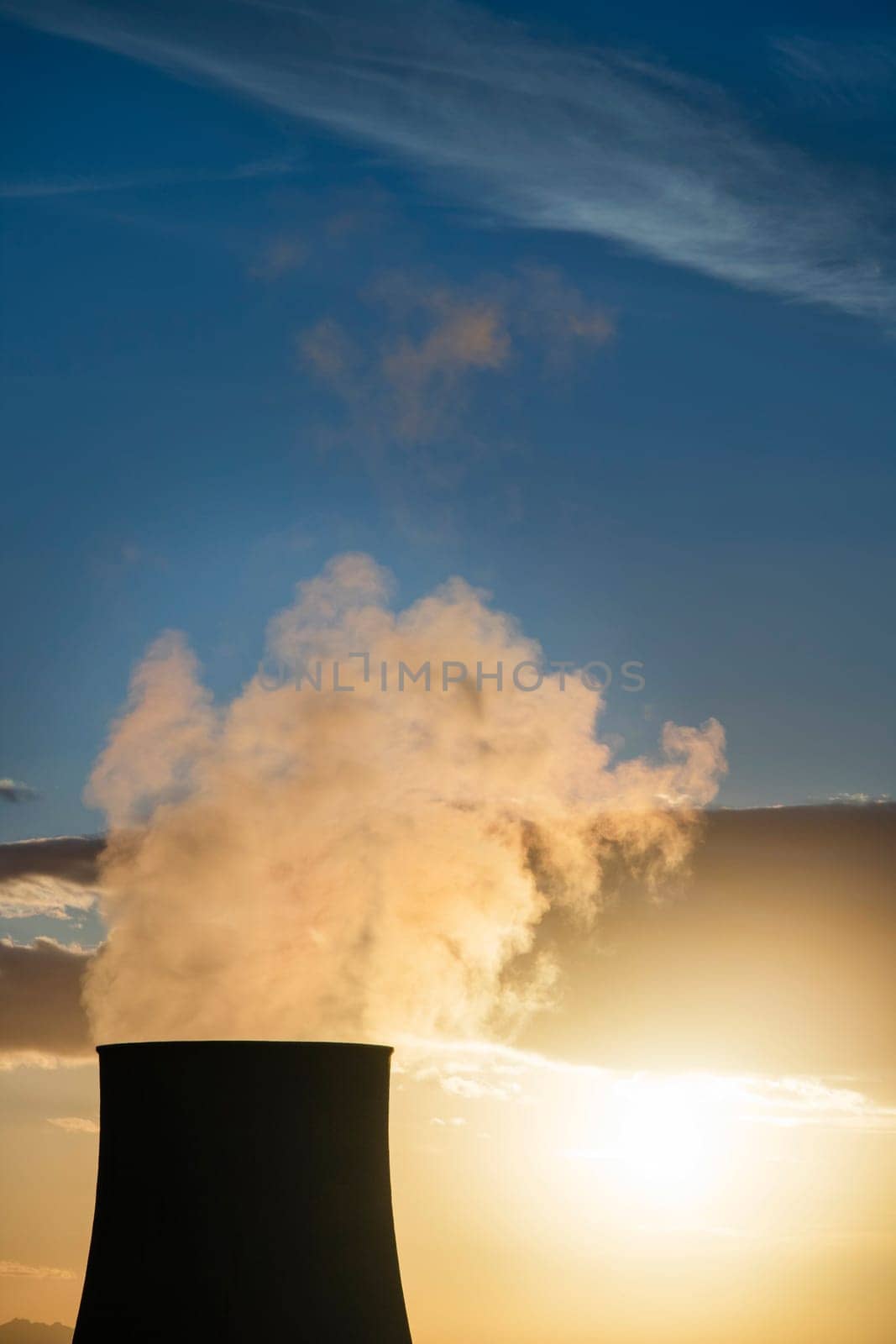 Sunset on the cooling chimney of the boraciferous blowers  by fotografiche.eu