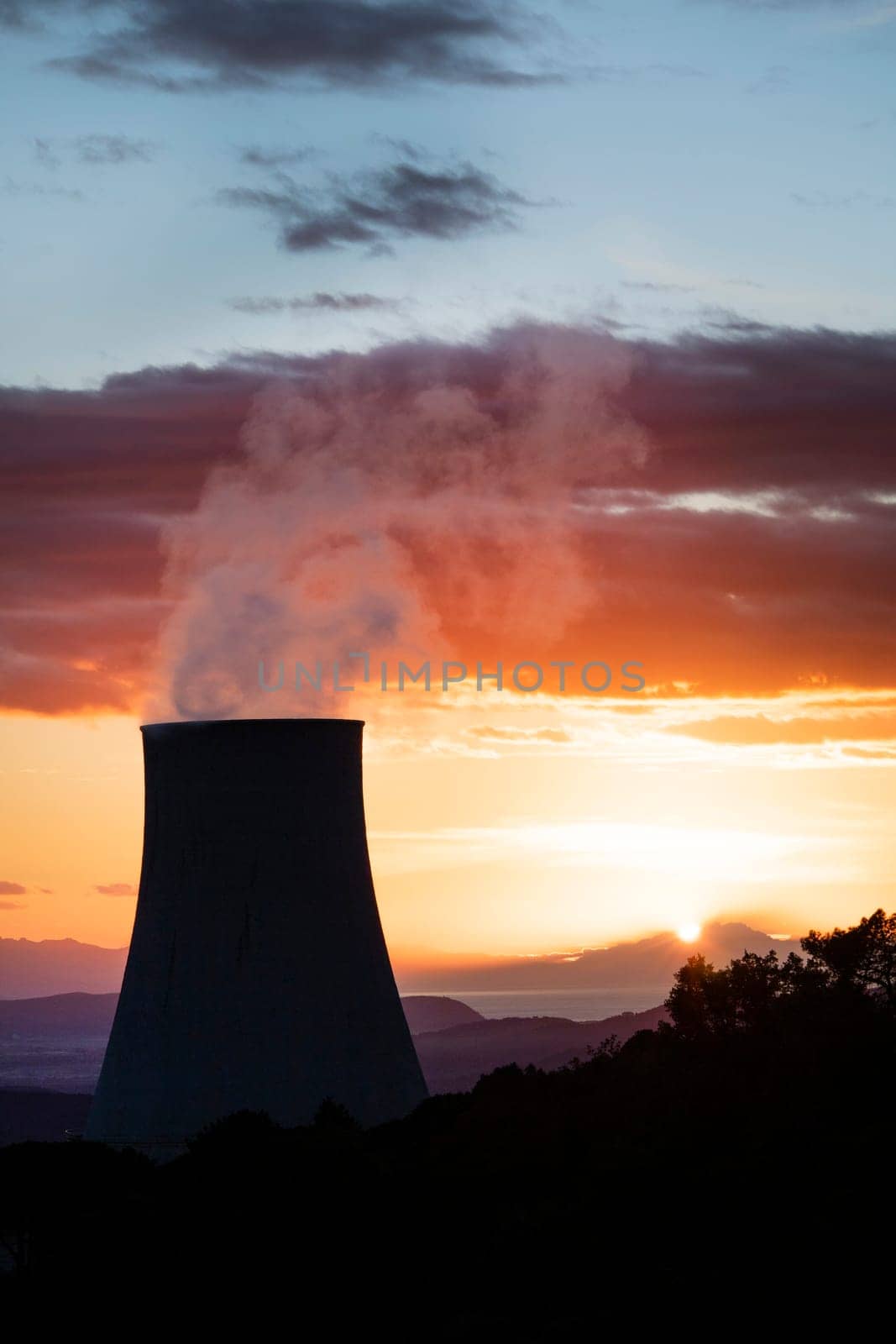 Sunset at the power plant for the exploitation of boraciferous blowers for the production of electricity in Tuscany, Italy 