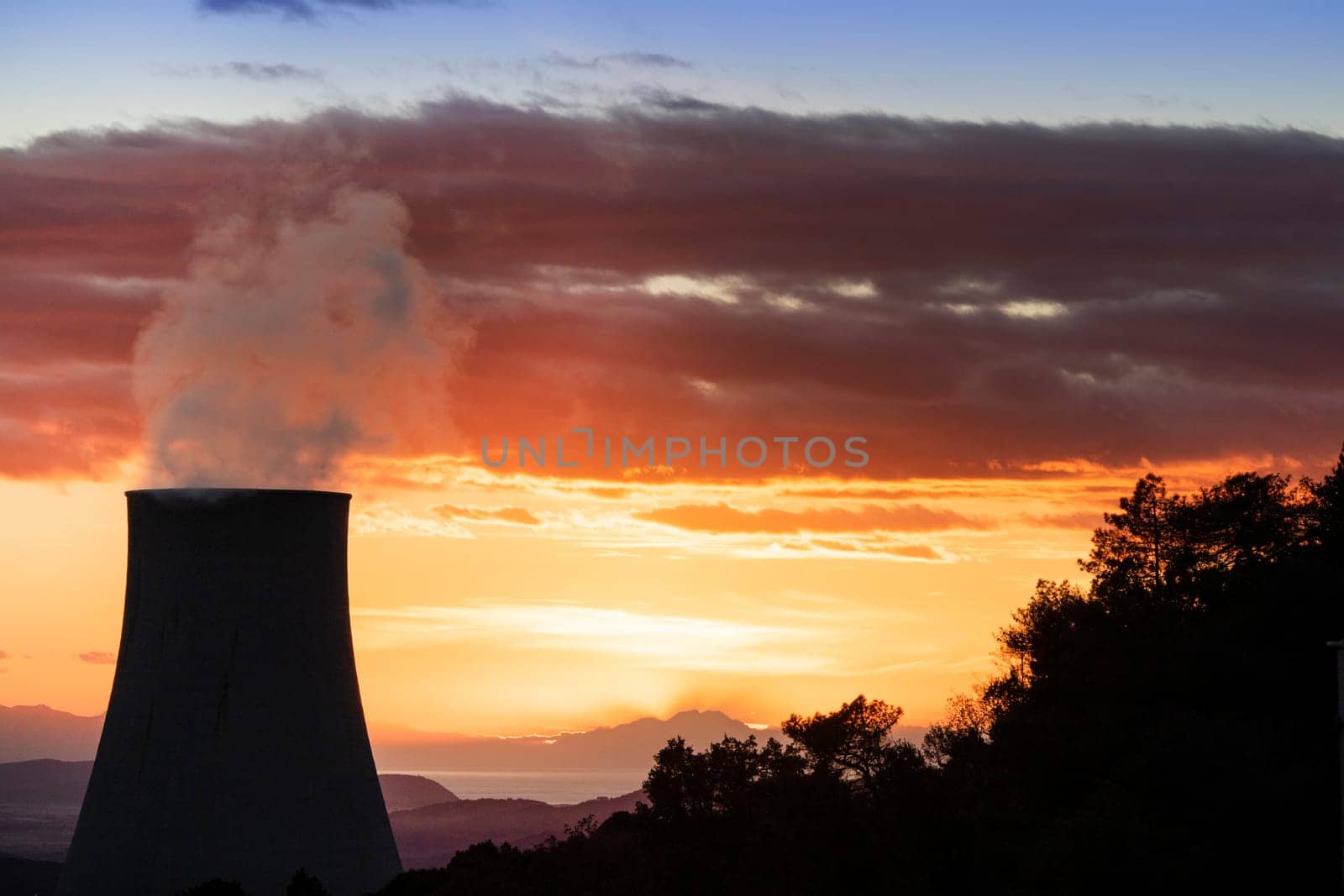 Sunset at the power plant for the exploitation of boraciferous blowers for the production of electricity in Tuscany, Italy 