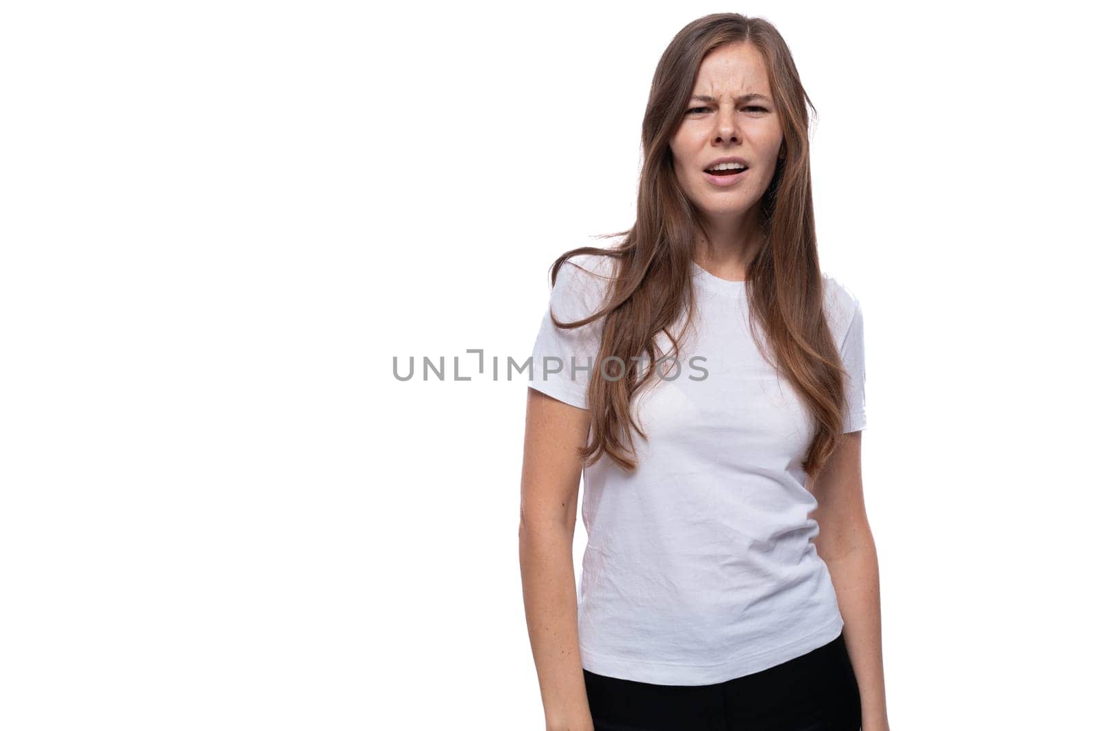 European young woman with straight brown hair wearing a white T-shirt by TRMK