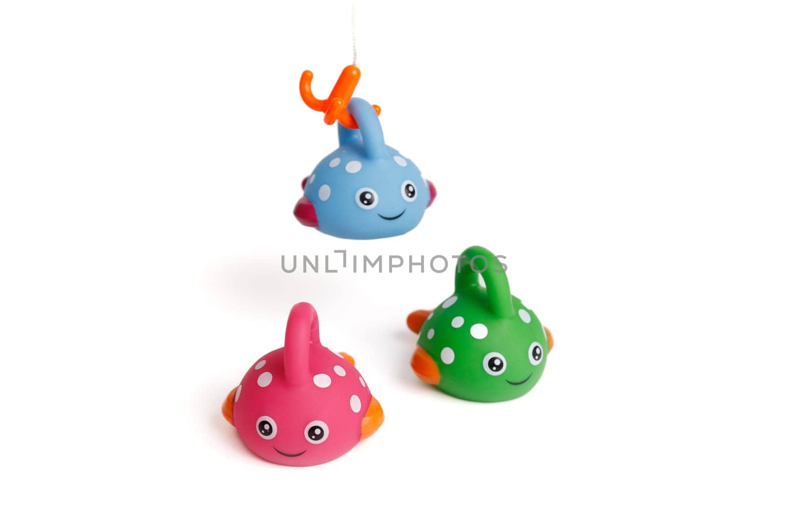 Funny toy children's colorful fish, one caught a hook by Rom4ek