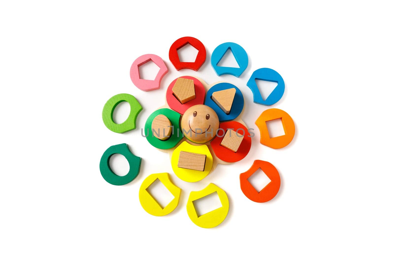 Wooden children's puzzle toy with colorful blocks of different shapes in form of funny sun, isolated on white background by Rom4ek