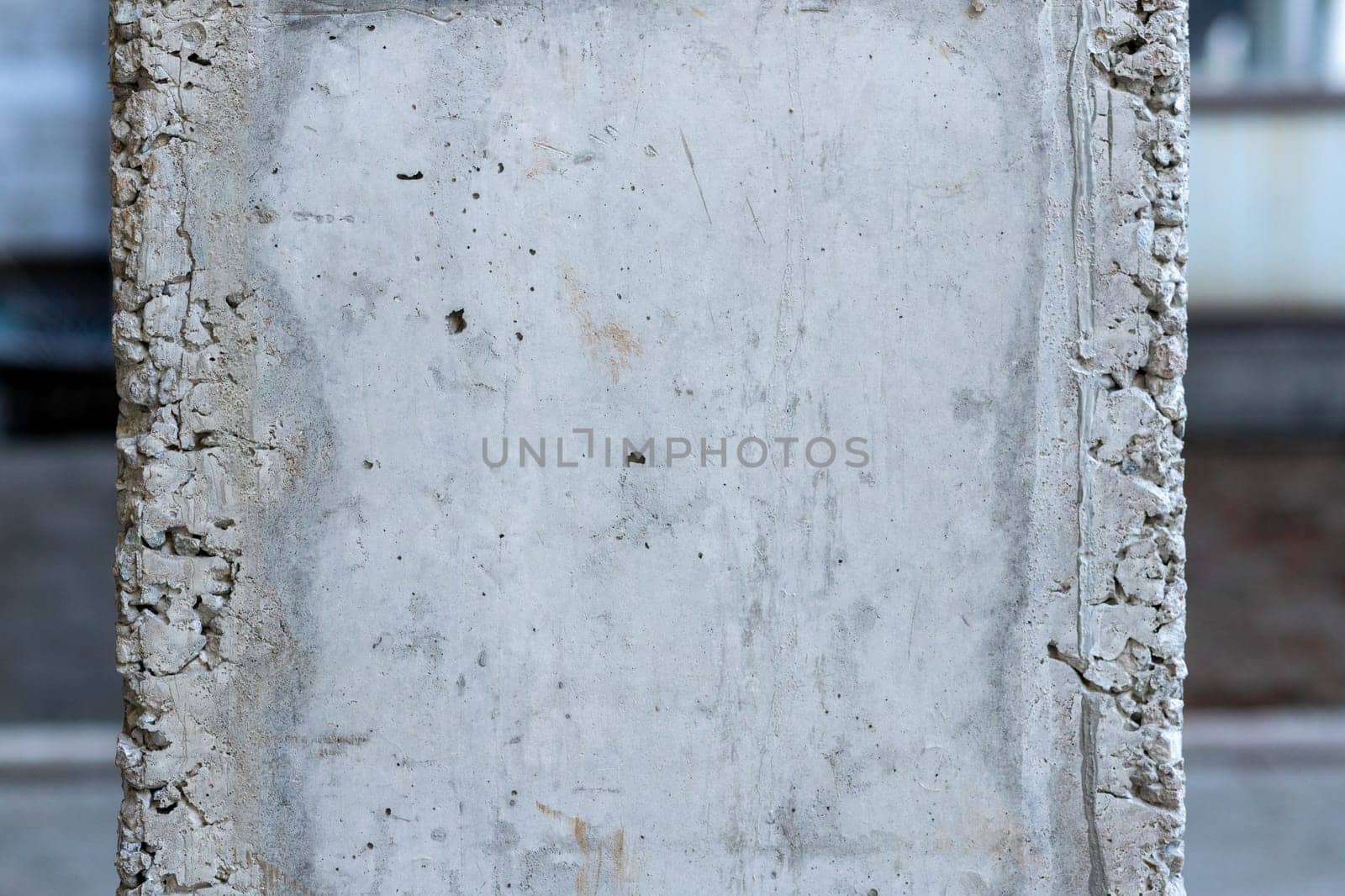 Close-up of a reinforced concrete column after formwork has been removed, copy space.