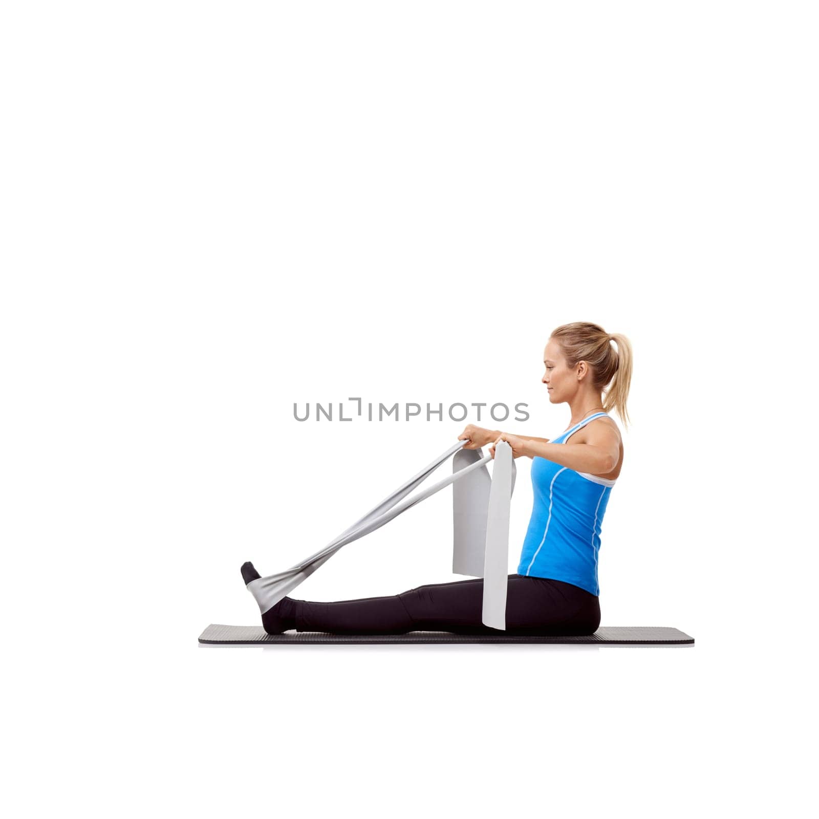 Fitness, resistance band and woman doing exercise in studio for health, wellness and bodycare. Sport, yoga mat and young female person from Australia with arms workout or training by white background.