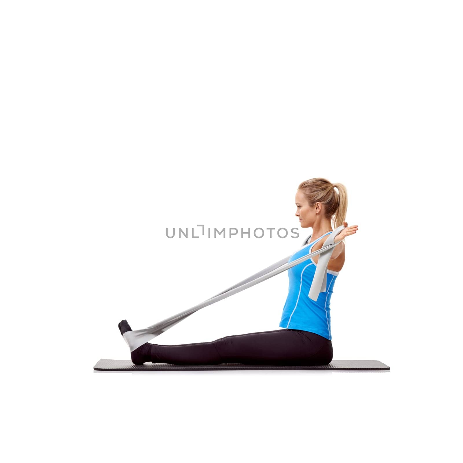 Fitness, resistance band and woman doing exercise in studio for health, wellness and bodycare. Sport, yoga mat and young female person from Australia with arms workout or training by white background.