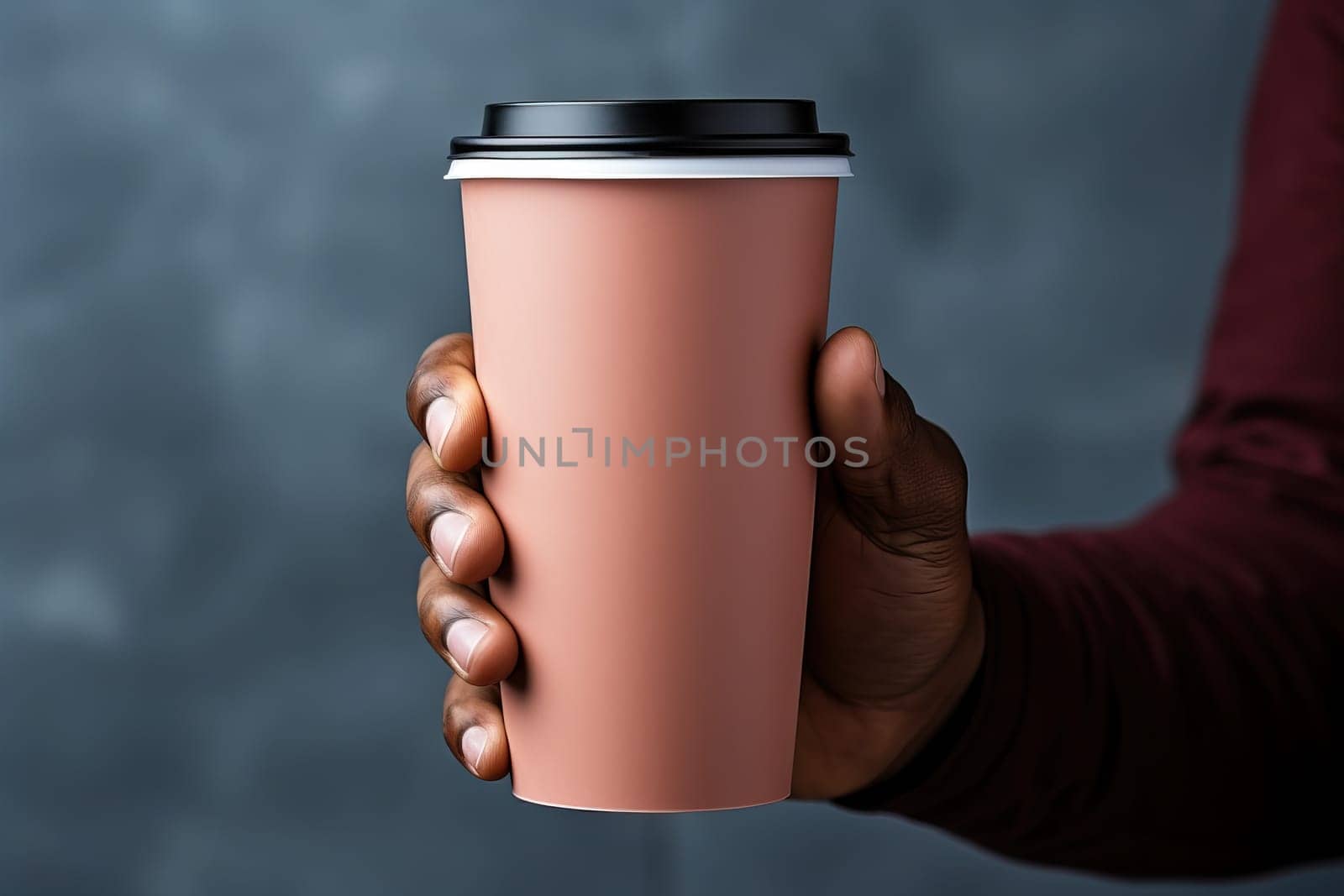 A man holds a paper cup for coffee, a mockup for manufacturers of branded cups for drinks, a banner for manufacturers of thermal paper cups.
