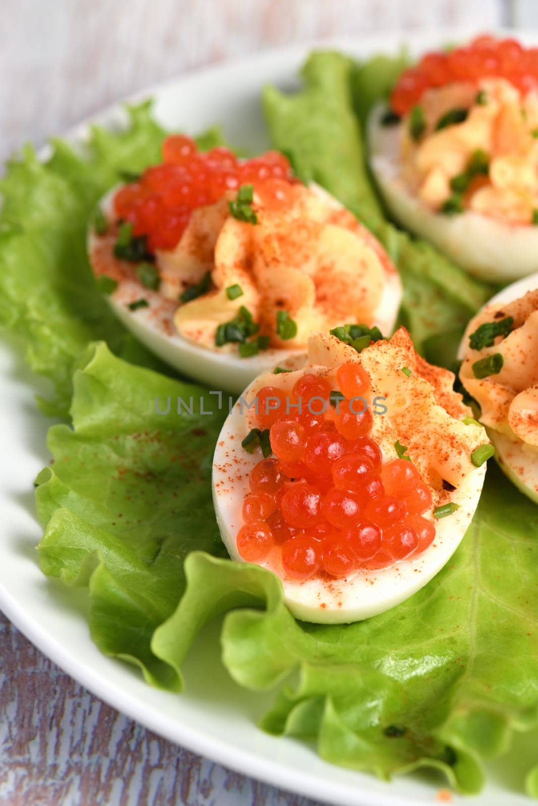 Stuffed eggs with salmon caviar by Apolonia