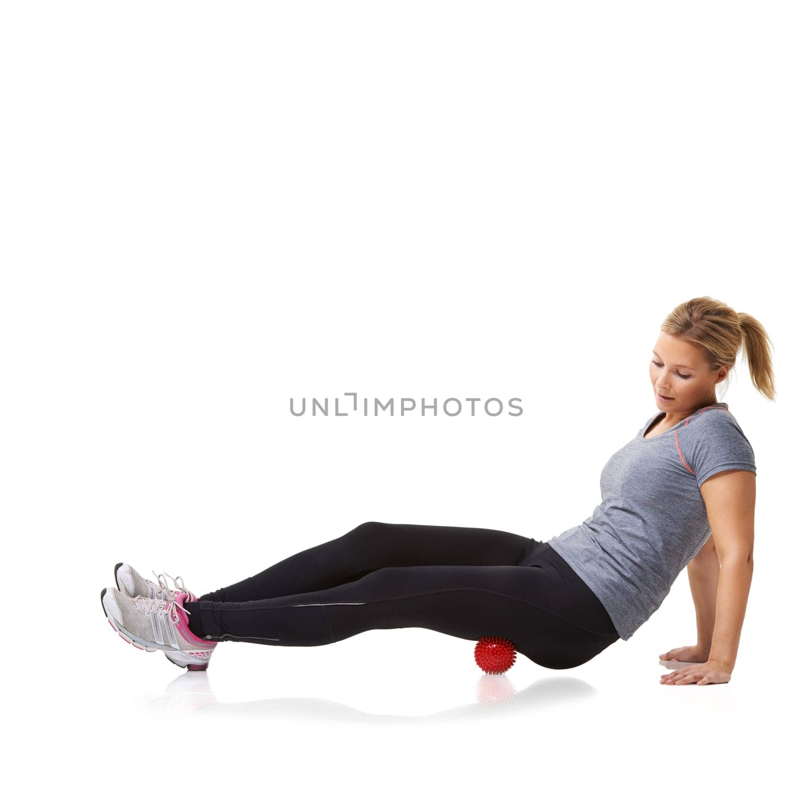 Woman, massage ball and healing or yoga in studio, injury and health or wellness by white background. Female person, pilates and physical therapy or rehabilitation for muscles in body and mockup.