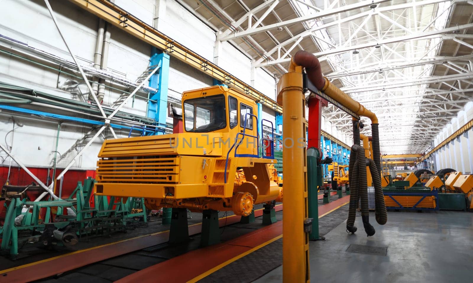 Half ready heavy truck standing at the end of production line.