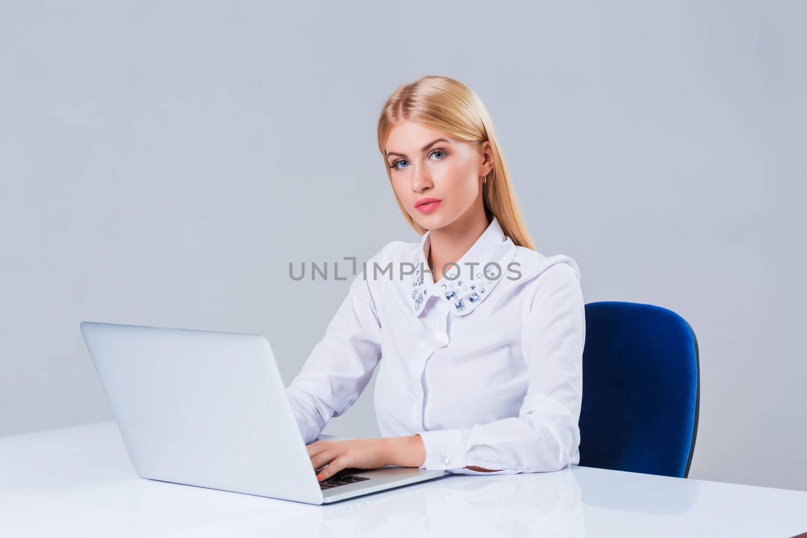 Young businesswoman working at laptop computer. by nazarovsergey
