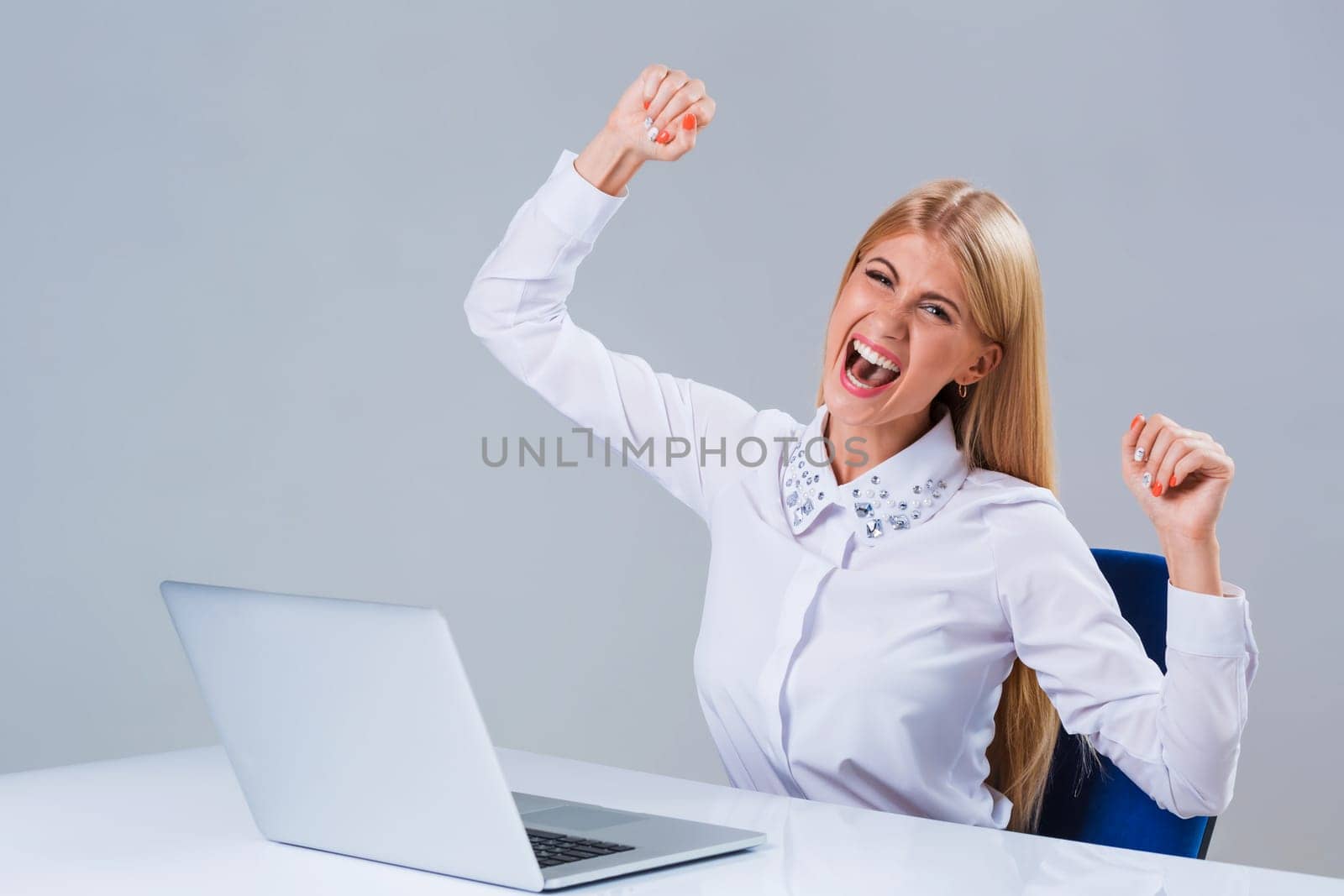 Young businesswoman working at laptop computer. she is happy pleased