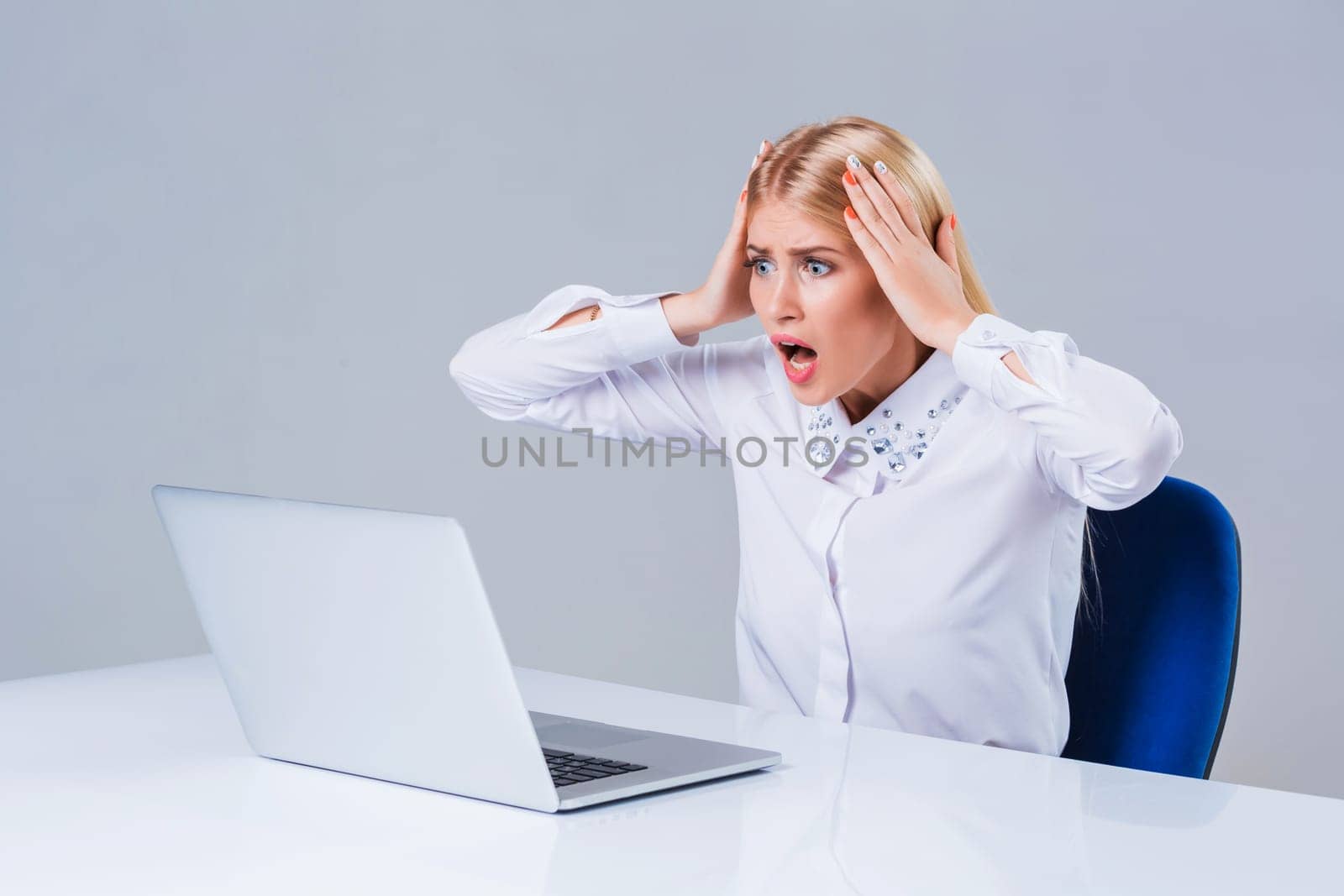 Young businesswoman working at laptop computer. crazy, distressed, shocked