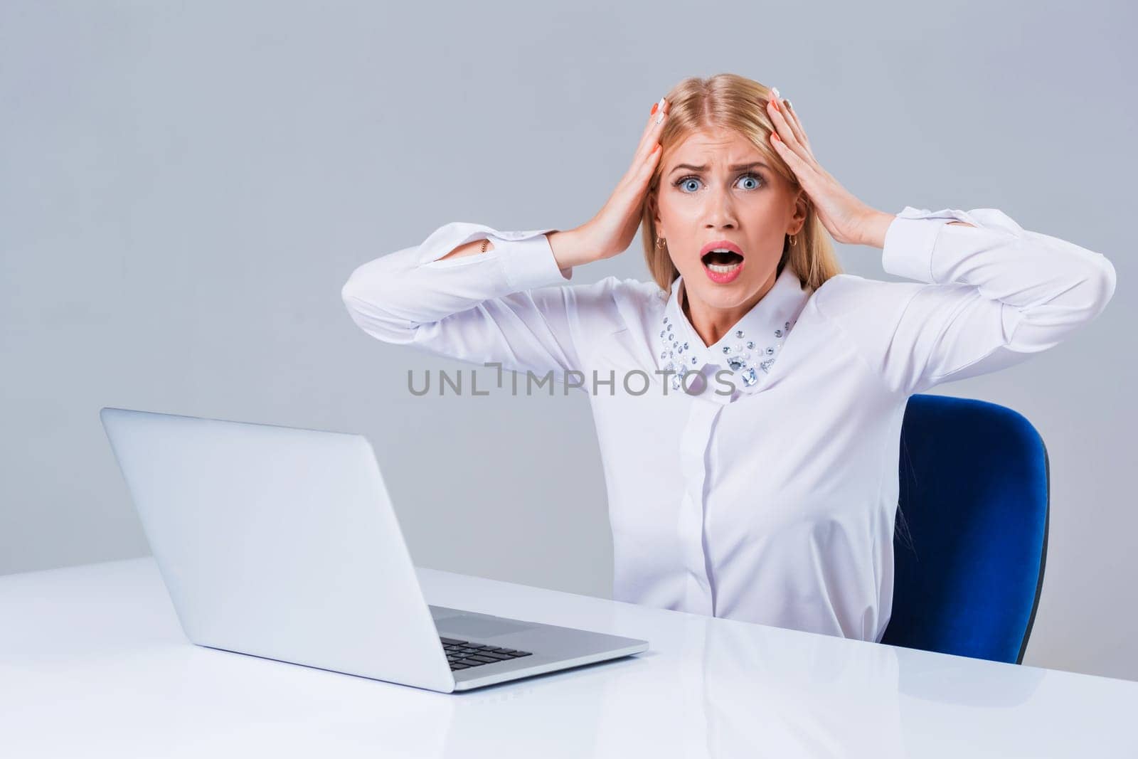 Young businesswoman working at laptop computer. crazy, distressed, shocked