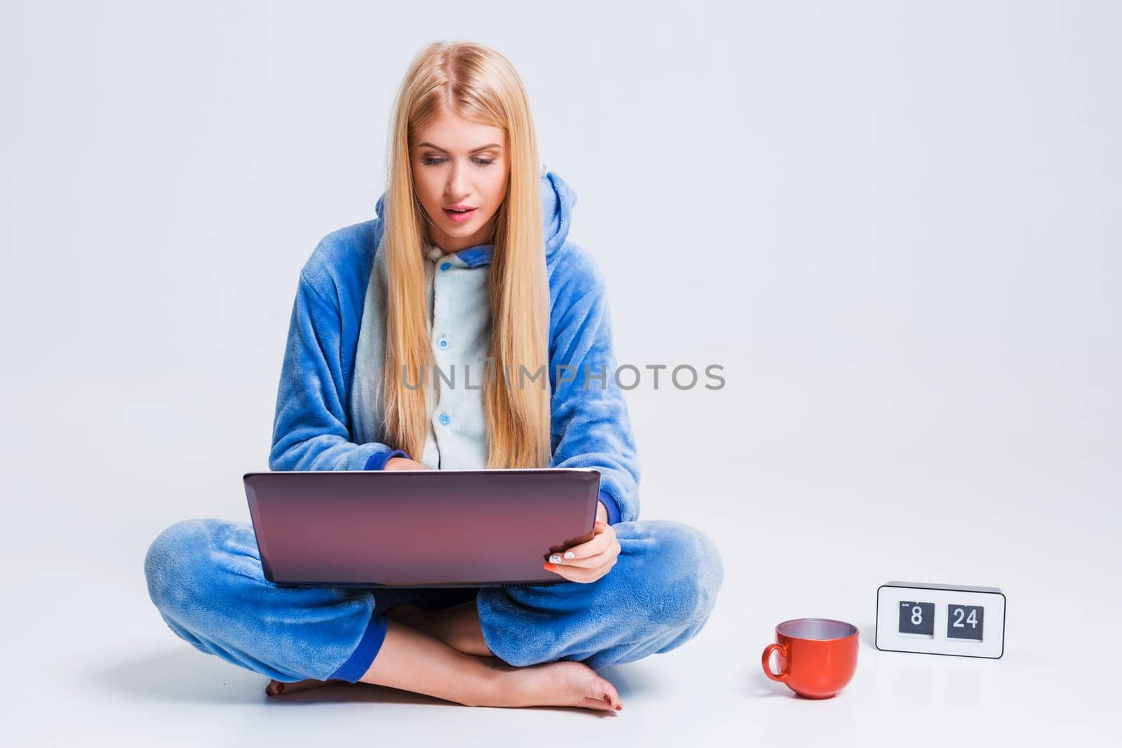 girl in pajamas with a laptop by nazarovsergey