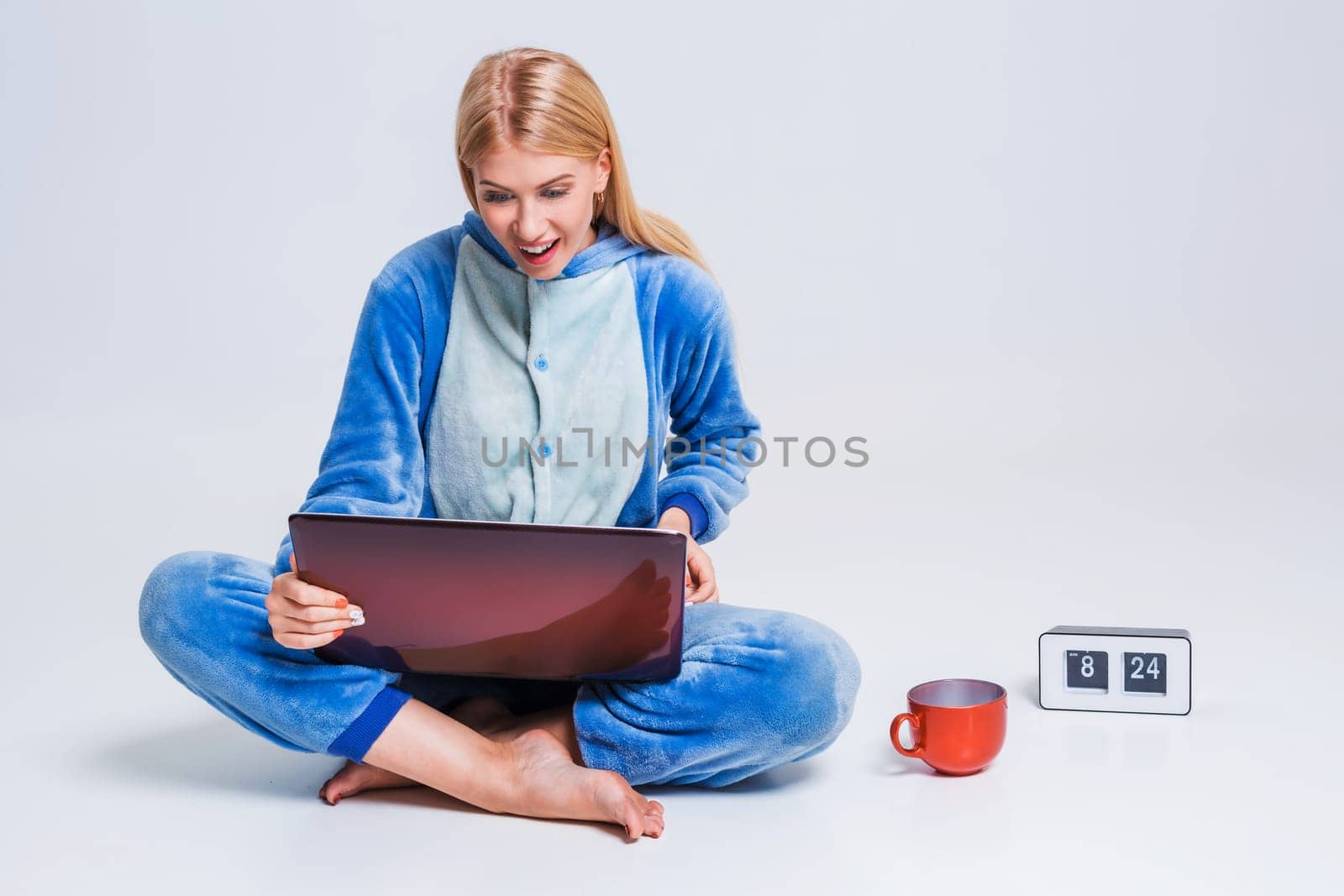 girl in pajamas with a laptop by nazarovsergey