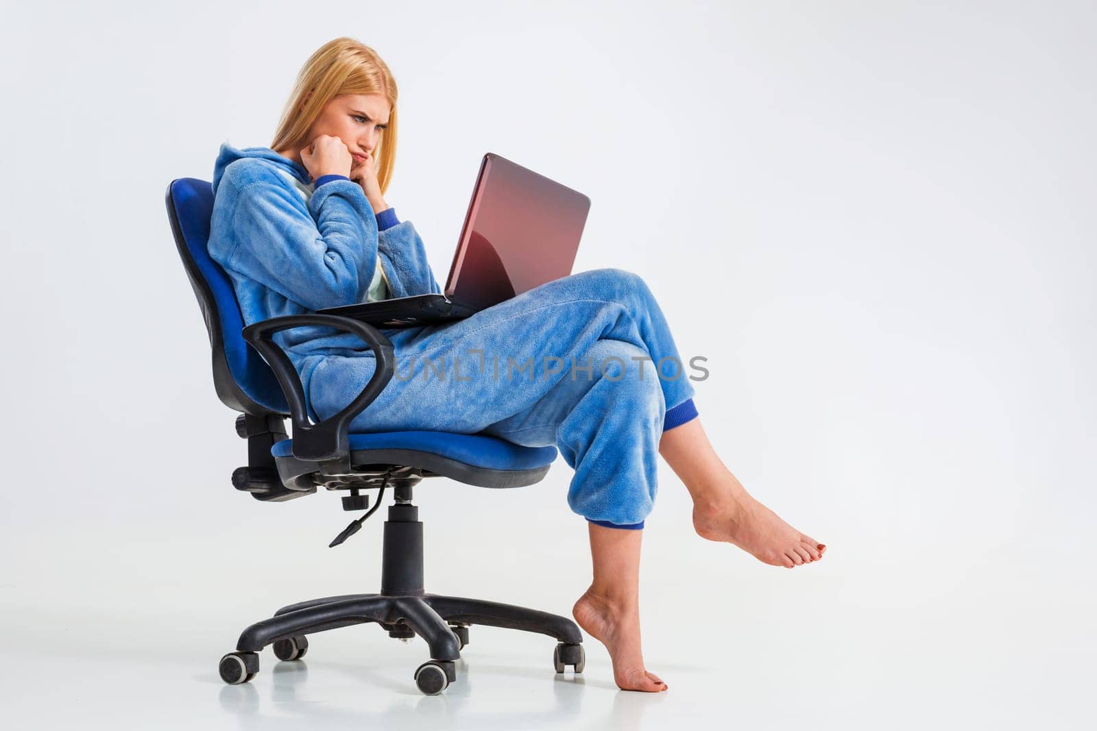 girl in pajamas with a laptop by nazarovsergey