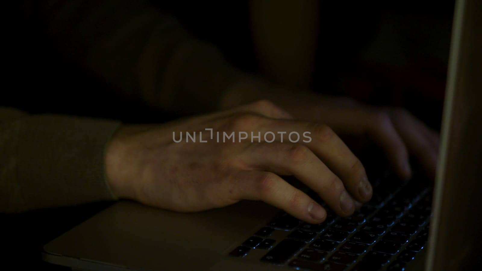 Close up for man hands typing fast on laptop computer, business, education, people and technology concept. Male hands of a young man typing fast.