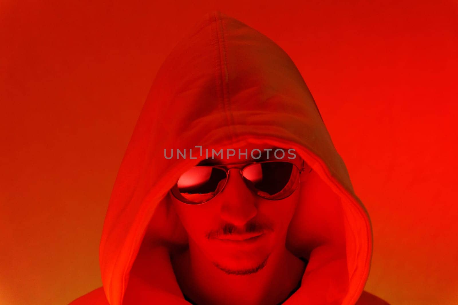 Red background light studio close-up portrait of a male model with a mustache and beard wearing sunglasses by darksoul72