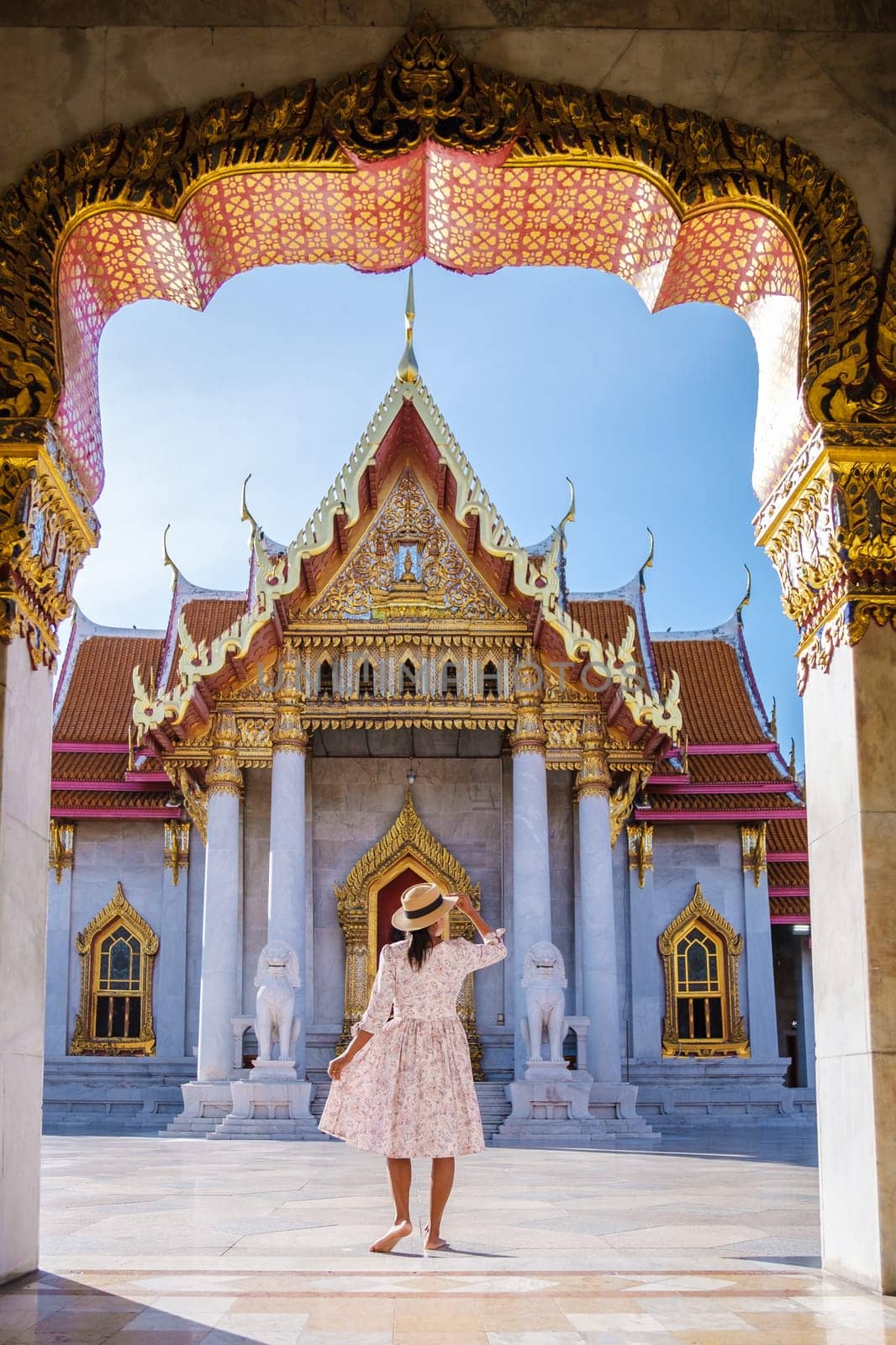 Wat Benchamabophit temple in Bangkok Thailand, The Marble temple in Bangkok. Asian woman with a hat visiting a temple, a women on a city trip in Bangkok