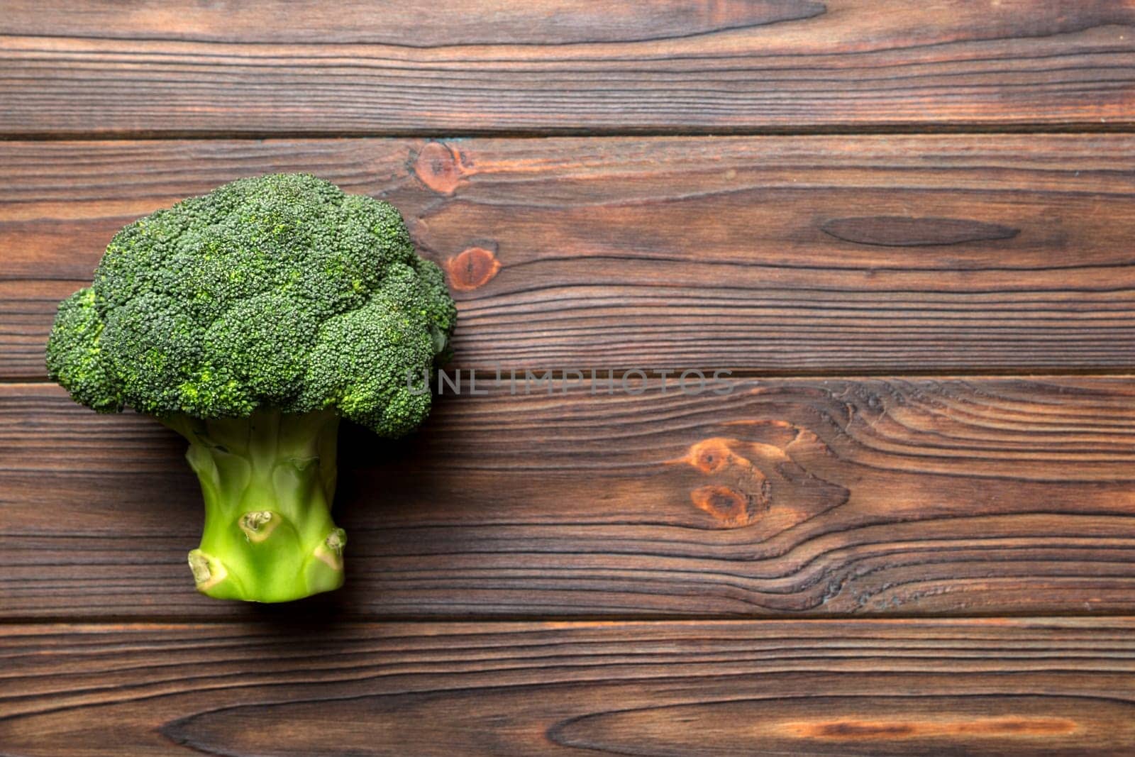 Broccoli scattered on white wooden table.copy space.Top view