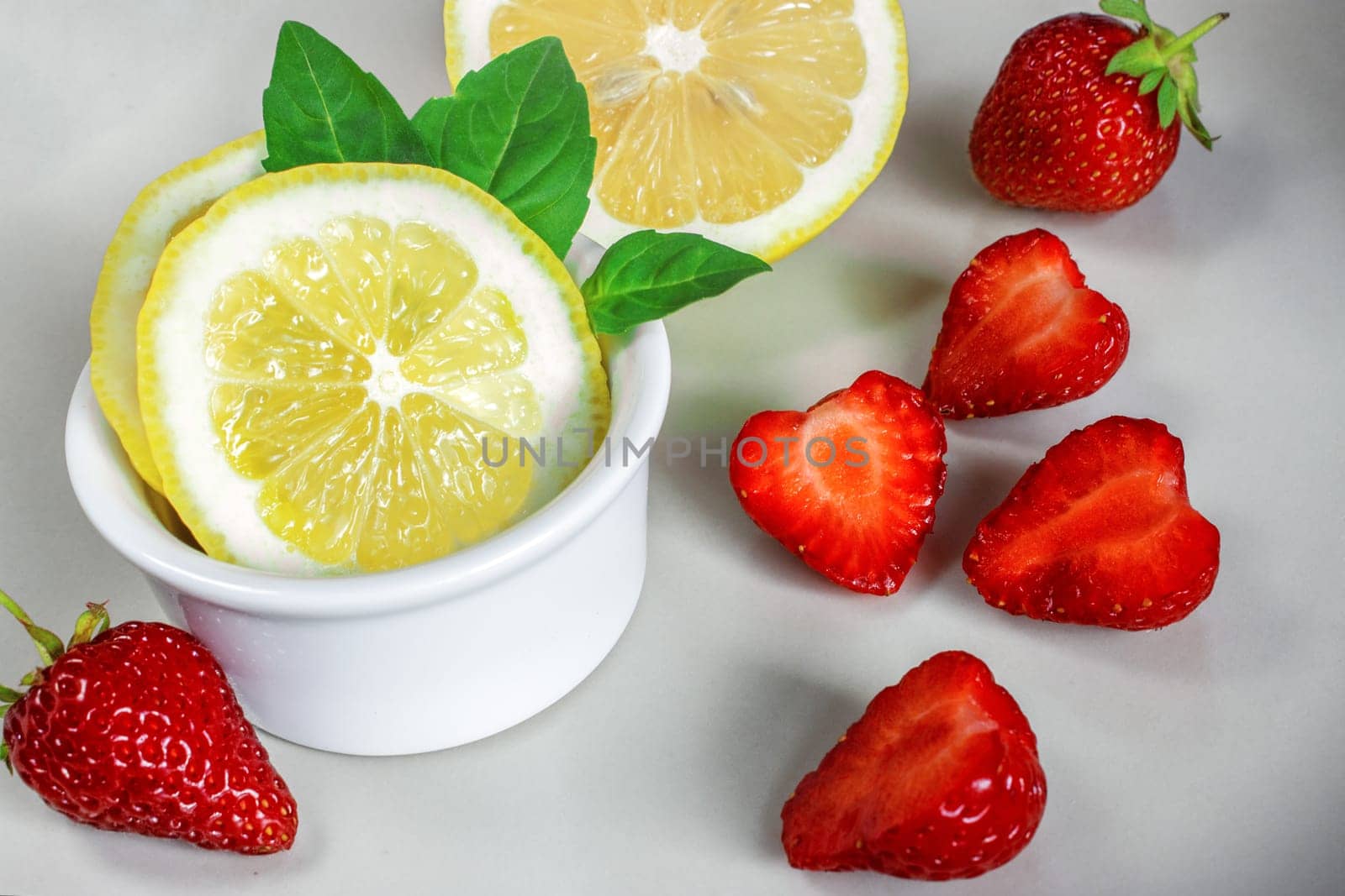 Lemon and strawberries, source of vitamin C.