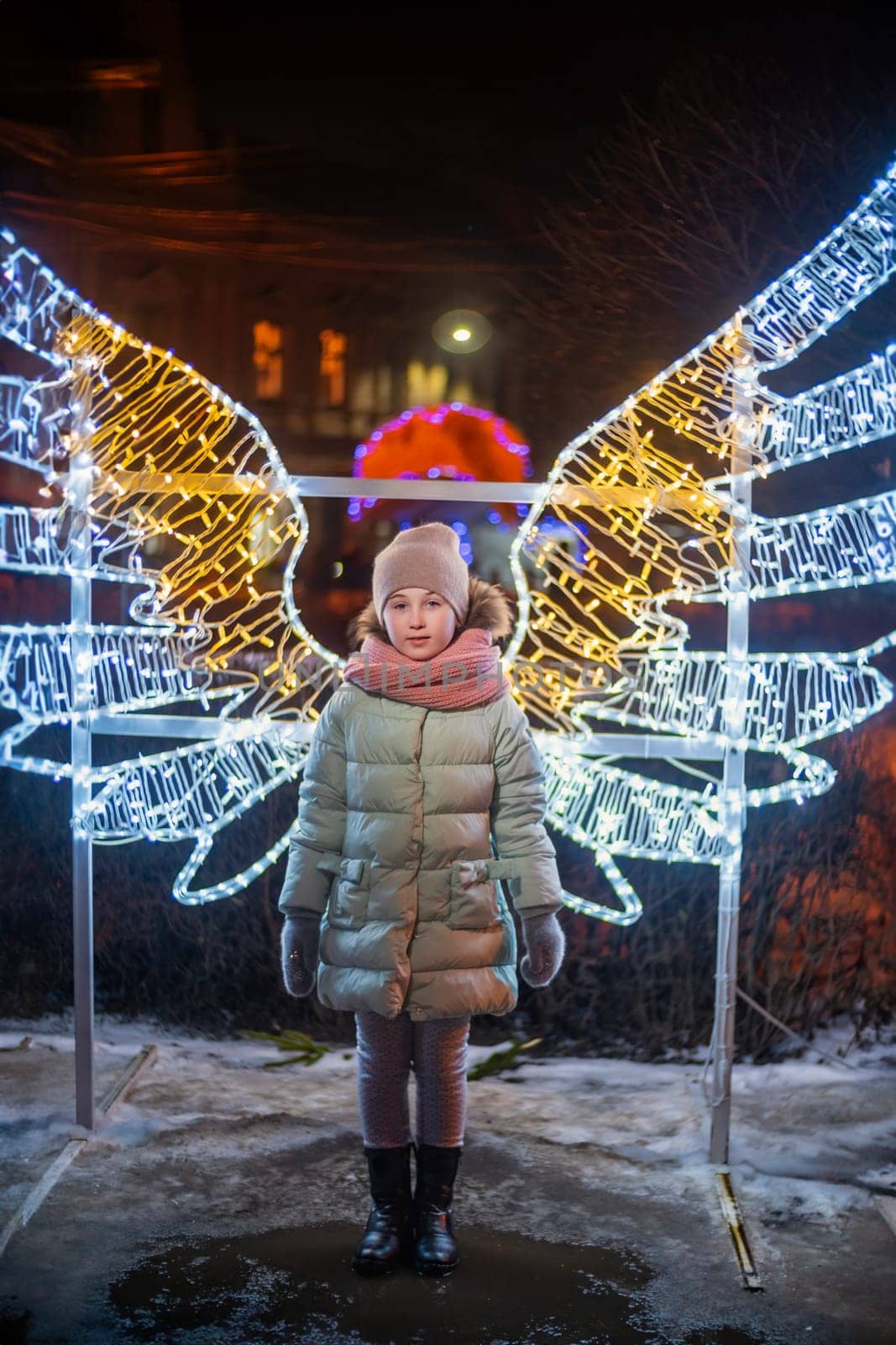 girl on the background of luminous wings evening time