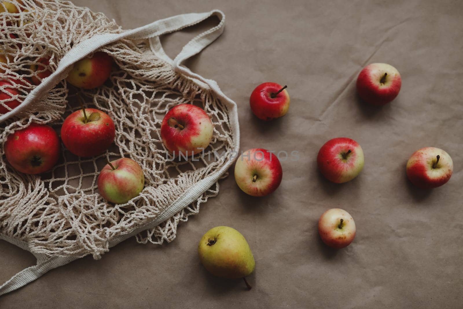 Fresh ripe red apples in a eco mesh shopping bag