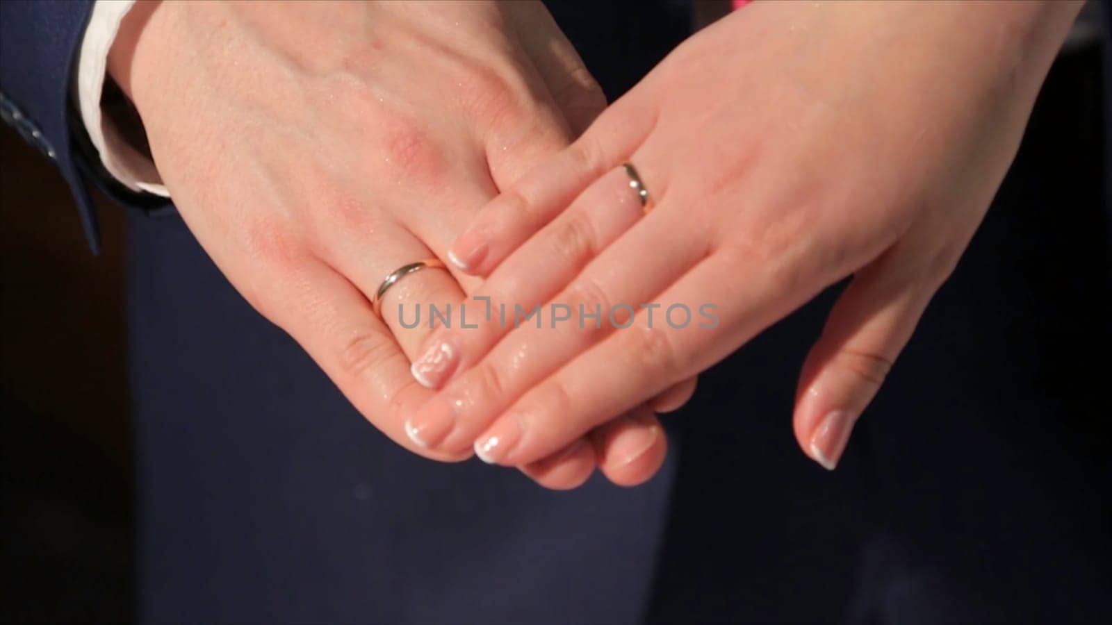 Newly wed couple's hands with wedding rings. Bride and groom with wedding rings. Hands and rings on wedding bouquet. Hands of the groom and the bride. Holydays. Wedding family, bride, groom and their children walking in the autumn park at wedding day. Wife and husband repeated wedding day photo shoot, but with children. Love HD