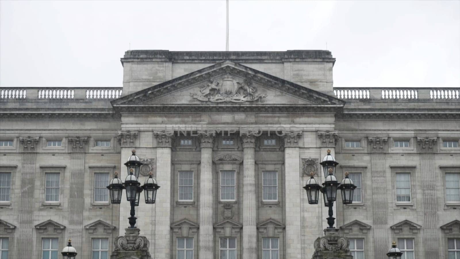 Close-up view of the Buckingham Palace exterior in rainy and gloomy autumn day. British landmarks