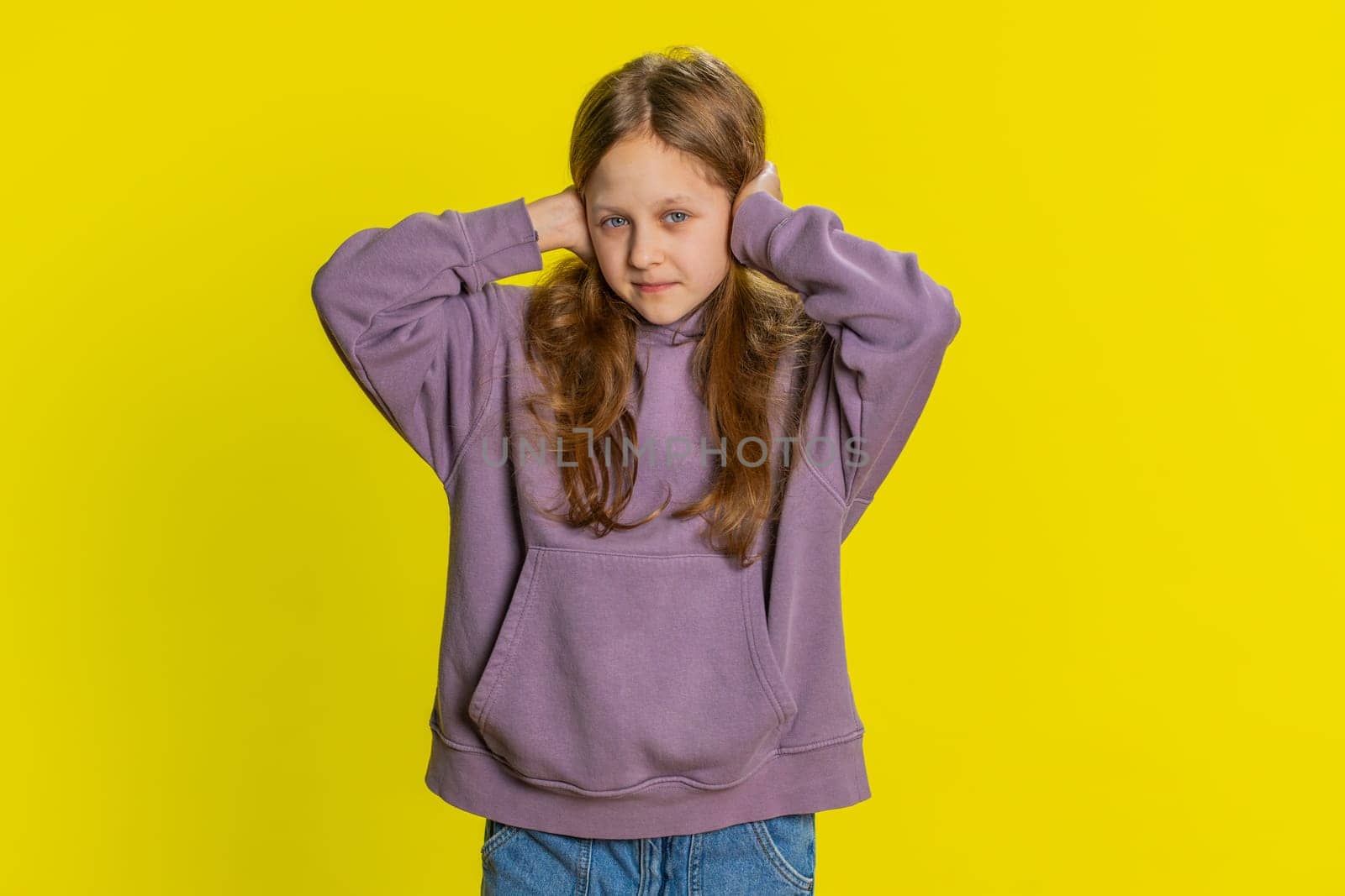 Frustrated young school girl kid covering ears ignoring unpleasant noise loud voices avoiding advice by efuror