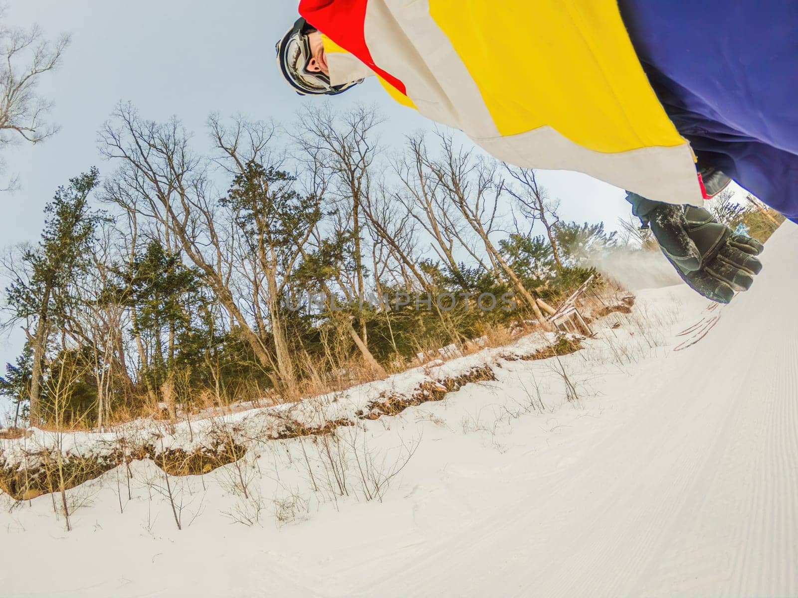 A daring man conquers snowy slopes with style, showcasing skill and thrill as he maneuvers on a snowboard, capturing the essence of winter adventure by galitskaya