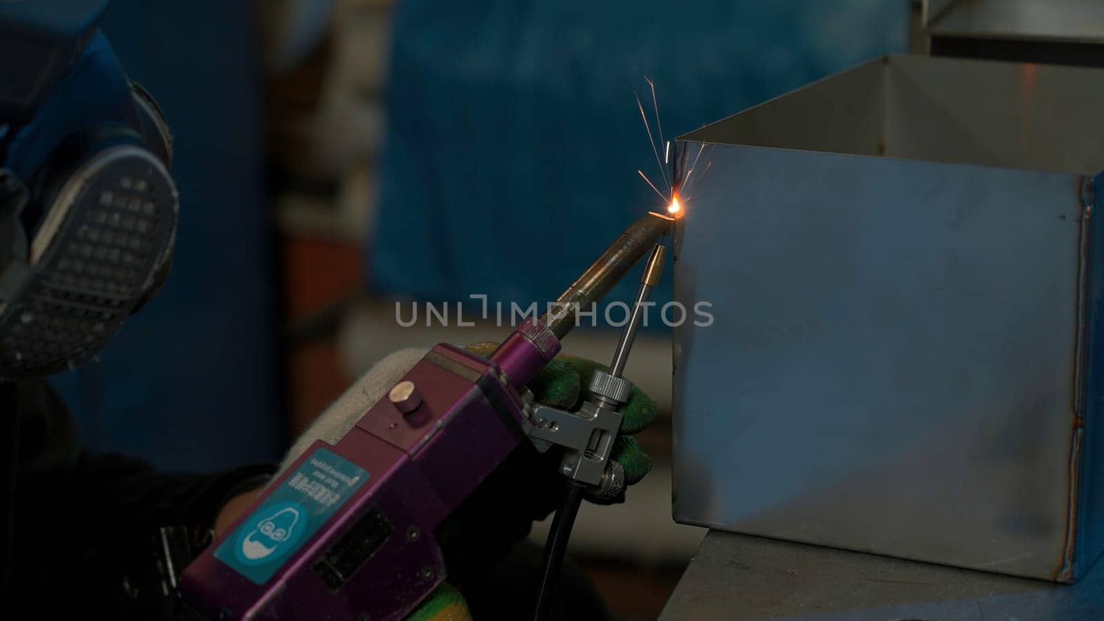 Steel welding, technician working on metal with welding machine in factory while wearing safety equipment. Creative. Construction maintenance service by manual skill labor concept