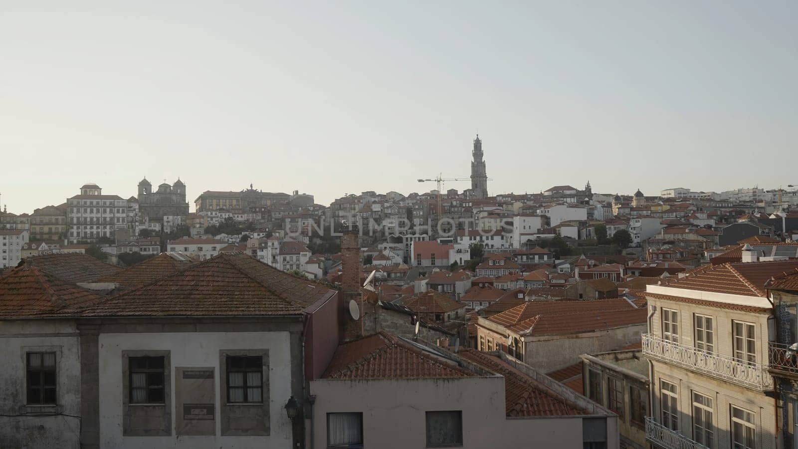 Beautiful view of ancient city with red roofs. Action. Old European city in morning sun. Morning in old town with red roofs in summer.