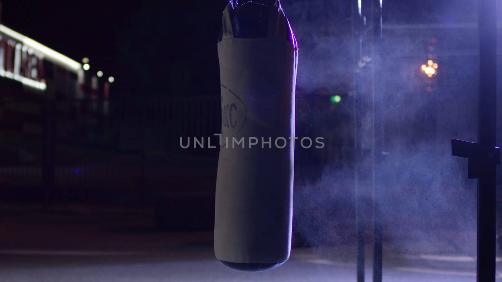 Gym,Punching bags. Punching bags in boxing room, sport. Punching bag at the dark sports ground.