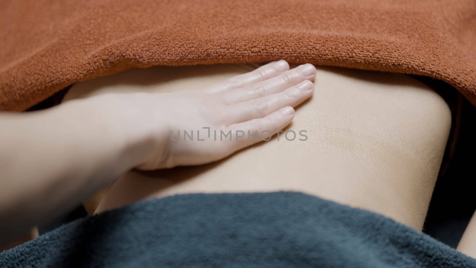 Wellness treatments.Action.A soft body smeared with ointment that is gently massaged. High quality 4k footage
