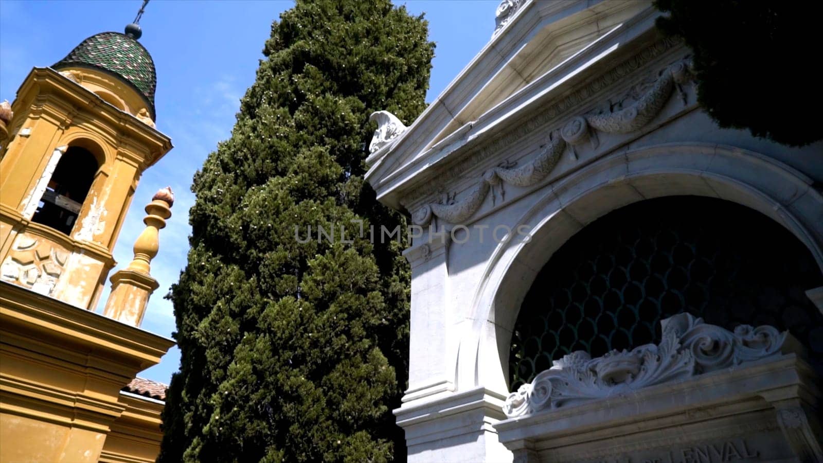 Beautiful architectural crypts in cemetery. Action. Best design architecture of crypts on european cemetery. Bottom view of crypts in park cemetery.