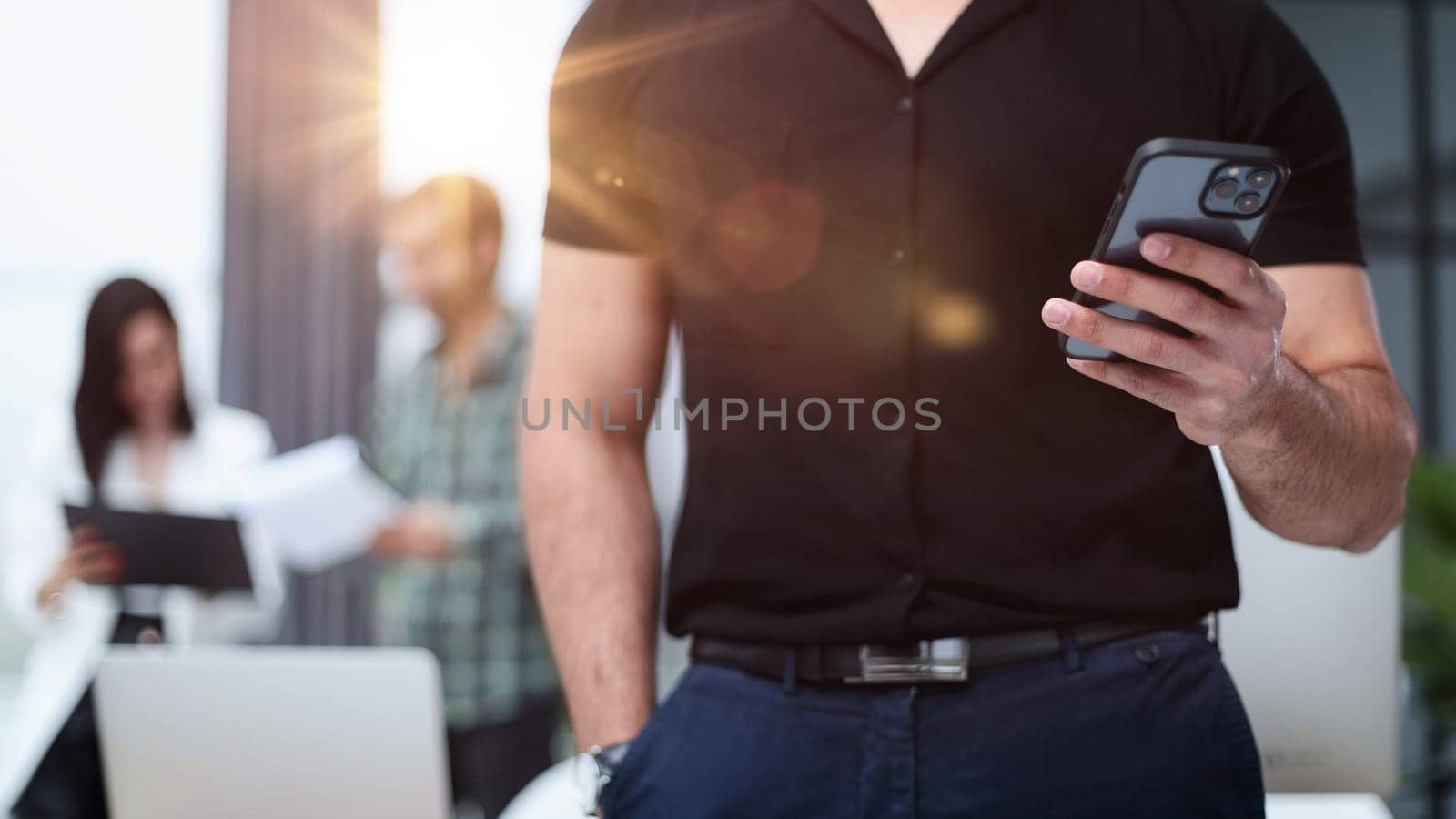 Modern gadget. Close-up of a smartphone screen in the hands of a businessman.