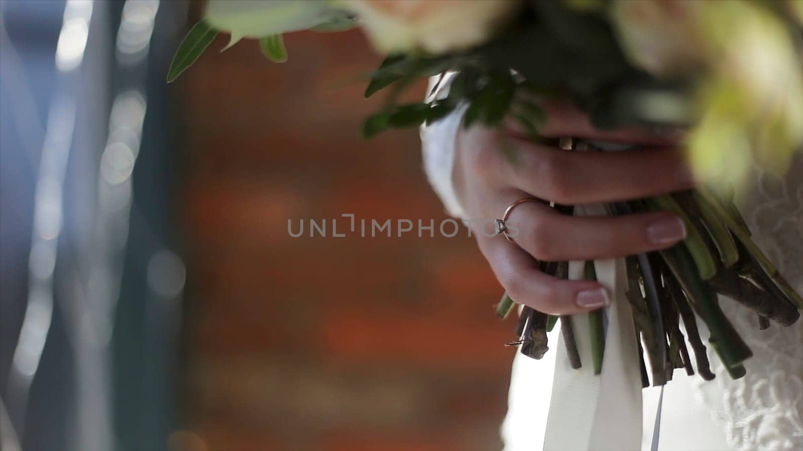 Close up of wedding bouquet. Close-up of vivid wedding bouquet at bride hands. Wedding flowers, bridal bouquet closeup. Decoration made of roses, peonies and decorative plants, close-up, selective focus.