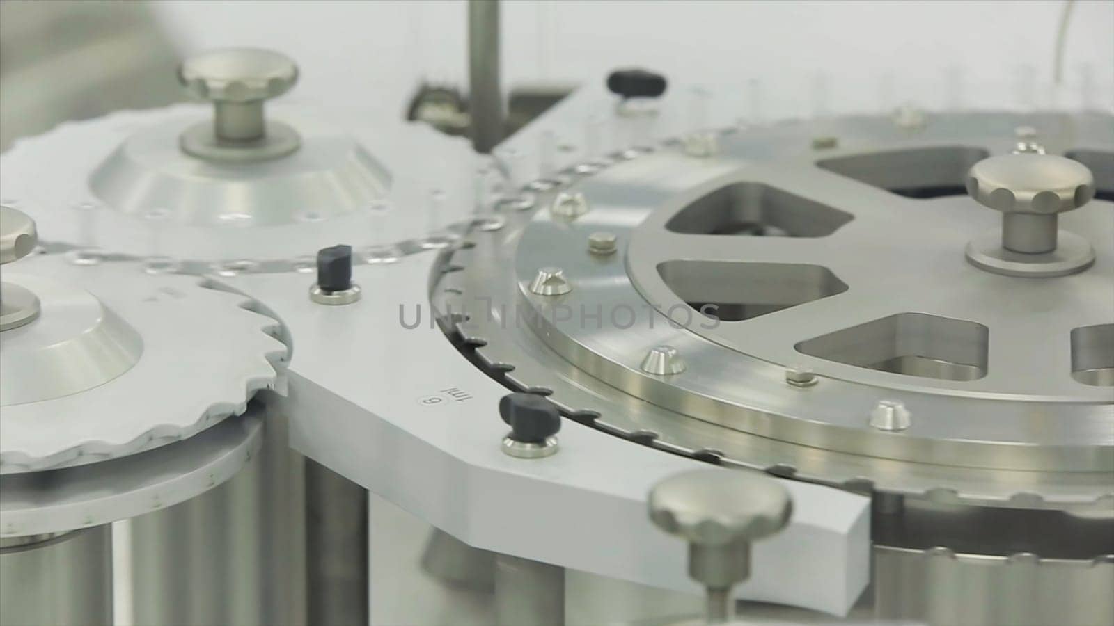 Ampoule filling and sealing machine equipment in pharmaceutical industry. Pharmaceutics. Pharmaceutical worker operates tablet blister packaging machine.