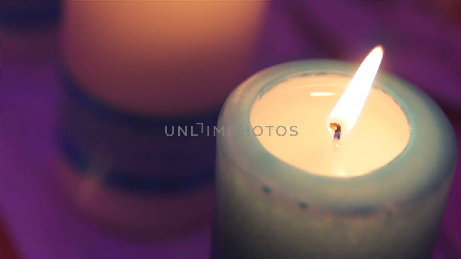 Lighting A Candle With A Match To Get A Romantic Candlelight. Amazing andles and candlesticks are on the table. Stay lights with the peaceful background of religious ceremony HD