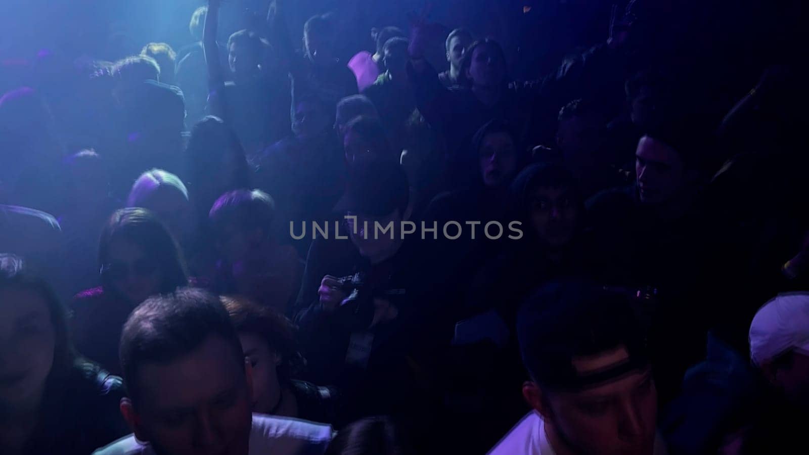 Poland - Warsaw, May 28, 2023: night club party with flashing lights and paying DJ. Clip. Concept of having fun and youth