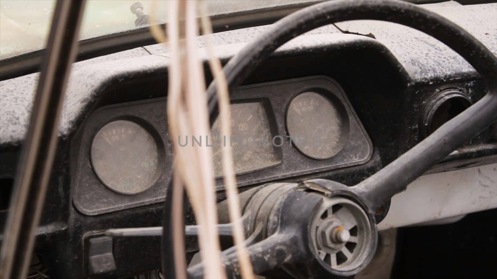 Wheel car of mid-20th century. Shot. Interior of old car with radio and control keys. Interior inside the Soviet machine. Concept of dystopia.
