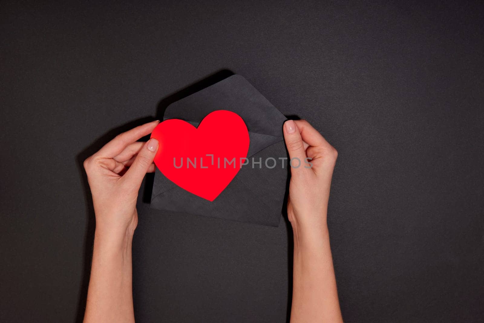 Hand puts heart envelope or takes heart out of envelope Send heart mail envelope by Demkat