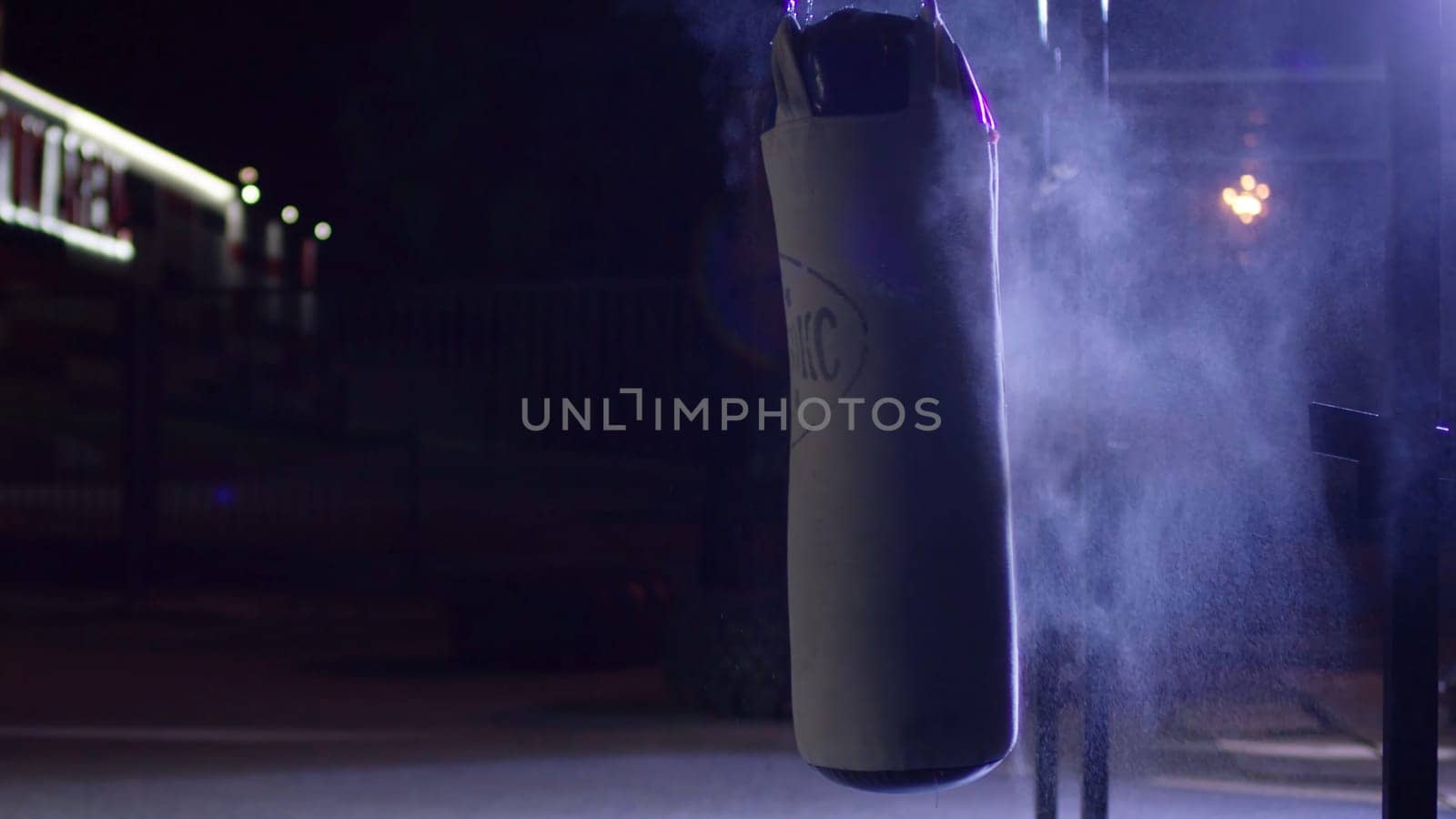 Gym,Punching bags. Punching bags in boxing room, sport. Punching bag at the dark sports ground.